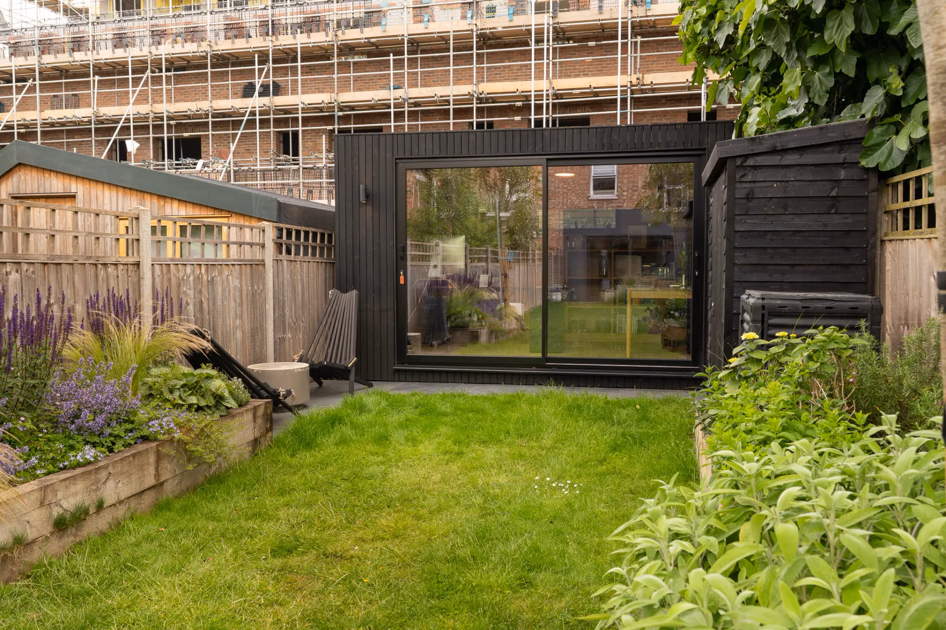 A black cladding garden room in London garden